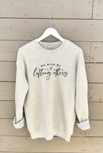Load image into Gallery viewer, WE RISE BY LIFTING OTHERS Mineral Graphic Sweatshirt
